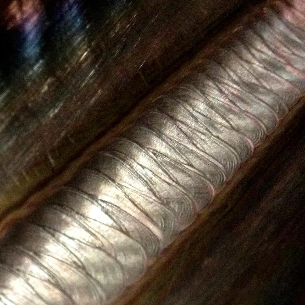 /img/44625-inspecting-welds.webp